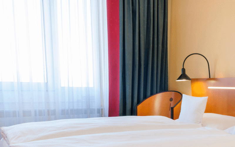 Hotel room with a bed and a chair