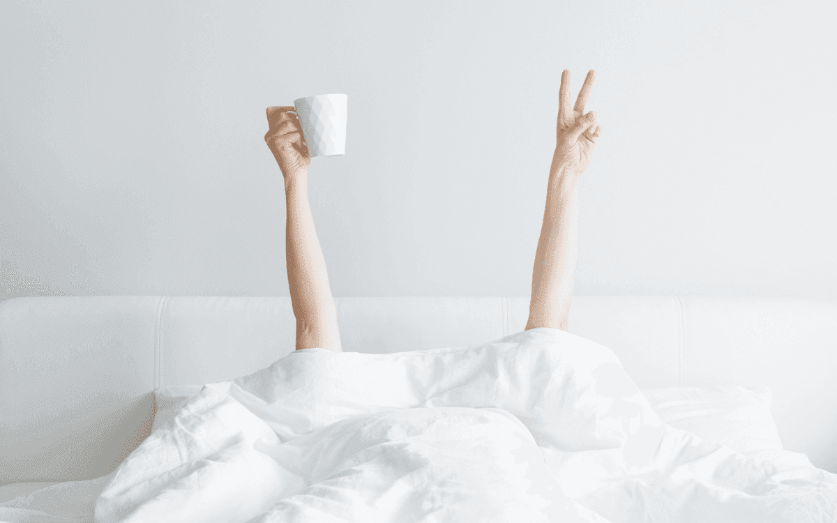 Person in Bed with a coffee mug