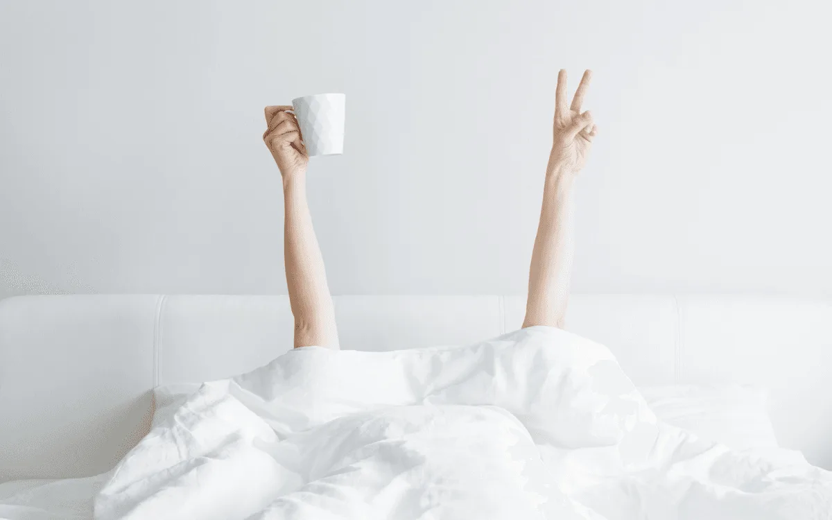Person in Bed with a coffee mug